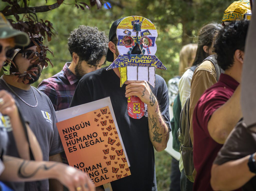 University of New Mexico students attend a campuswide walkout to demand ICE stays off campus Thursday afternoon in front of Scholes Hall.