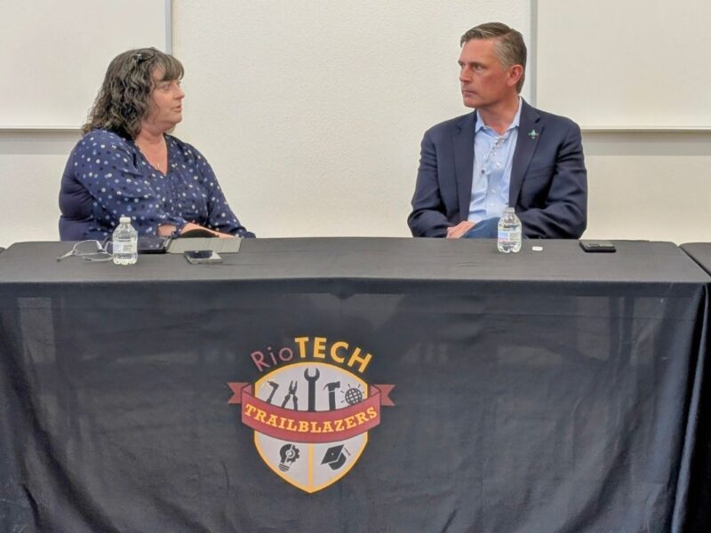 Sen. Martin Heinrich speaks with Rio Rancho School Employee Union President Billie Helean during a roundtable event in Rio Rancho on April 16.