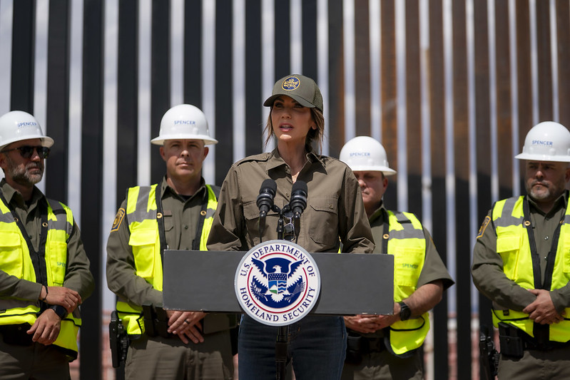 Department of Homeland Security (DHS) Secretary Kristi Noem speaks during a press conference at the border wall in Santa Teresa, New Mexico, August 19, 2025. (DHS photo by Tia Dufour)

