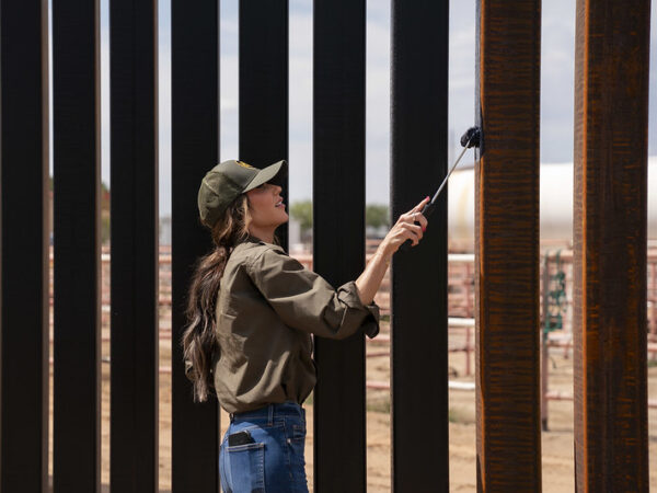 Homeland Sec. Noem comes to New Mexico to paint border wall black because Trump thinks it will make it too hot to climb