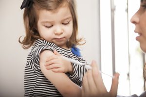 Little girl getting a flu shot