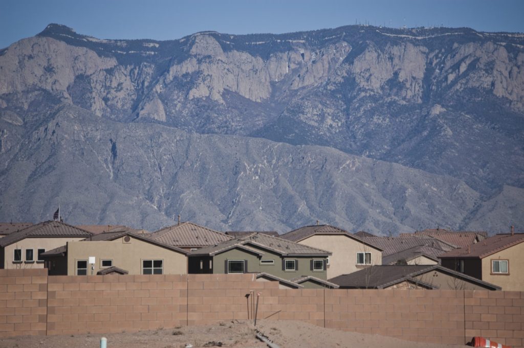Loose sand and construction debris fill empty lots along the westernmost edge of the Loma Colorado development in Rio Rancho. Photo by Margaret Wright