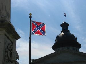 Confederate battle flag flying in front of the South Carolina capitol building. Photo Credit: Jason Lander cc