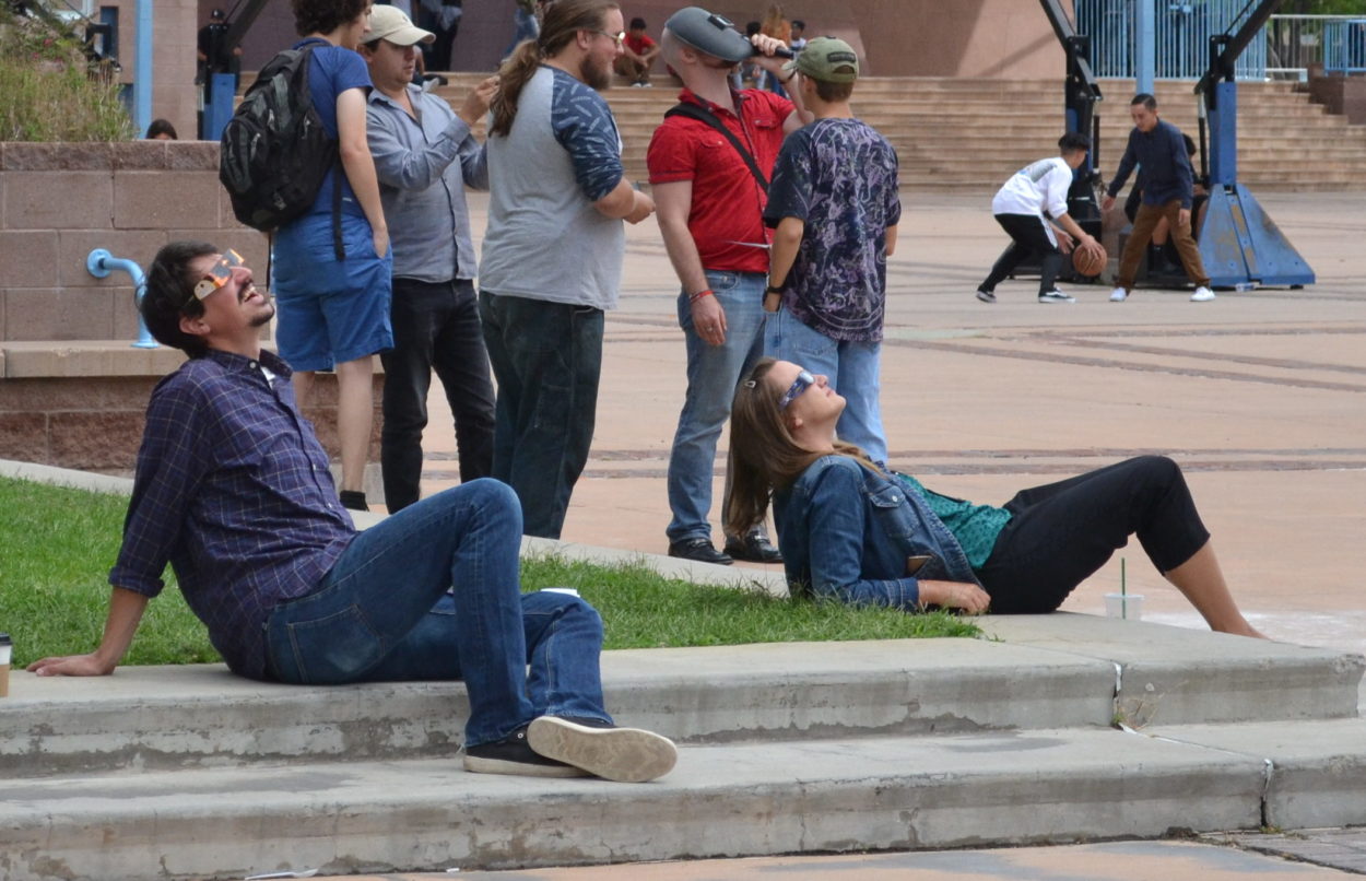 Clouds don’t deter eclipse-watchers in downtown Albuquerque