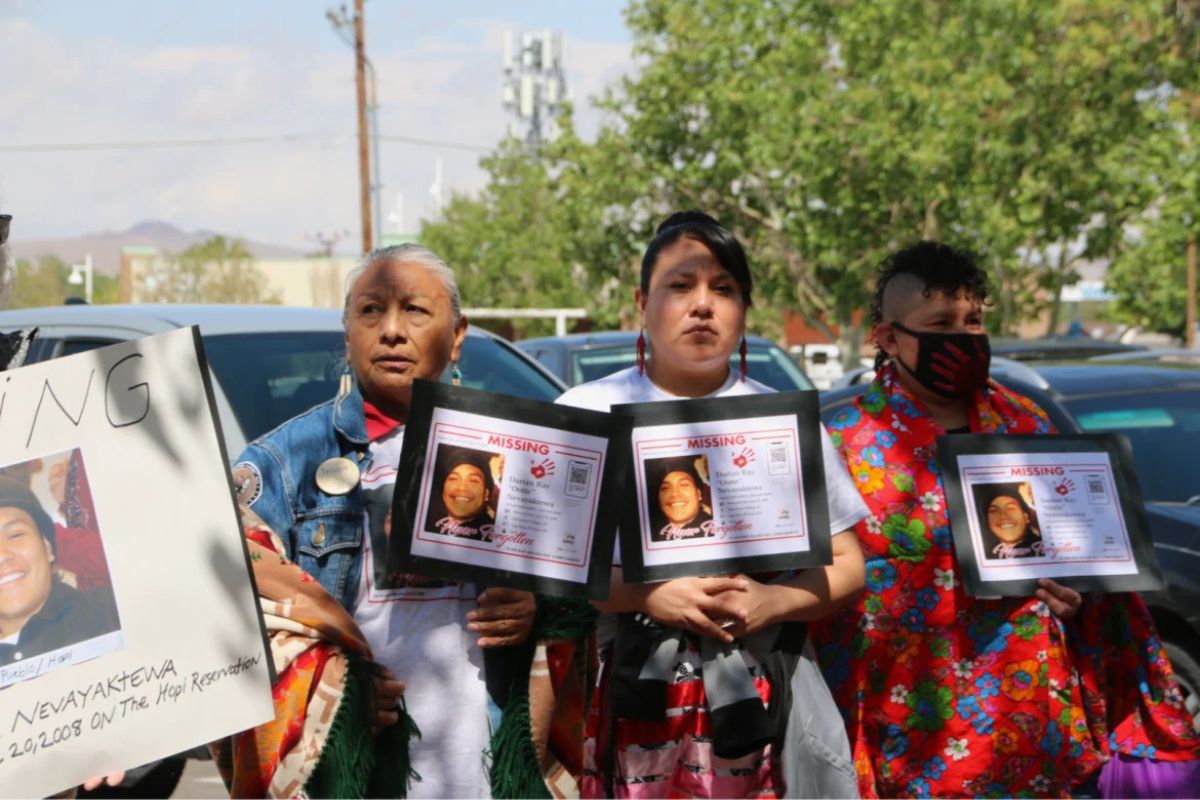 Relatives of Darian Nevayaktewa, who went missing from the Hopi reservation in 2008, hold posters for him outside the Indian Pueblo Cultural Center on May 5, 2025. Credit: Bella Davis/New Mexico In Depth