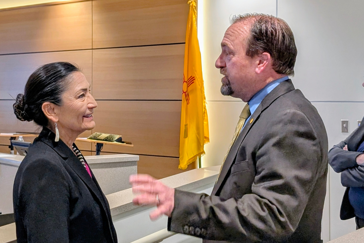 Deb Haaland, left, and Gregg Hull talk before a forum for gubernatorial candidates on April 28 in Rio Rancho. (Kevin Hendricks)